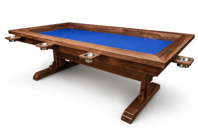 Custom black walnut board game table with a blue recessed gaming surface, mechanical accessory rail system, and solid wood trestle base on a white background.