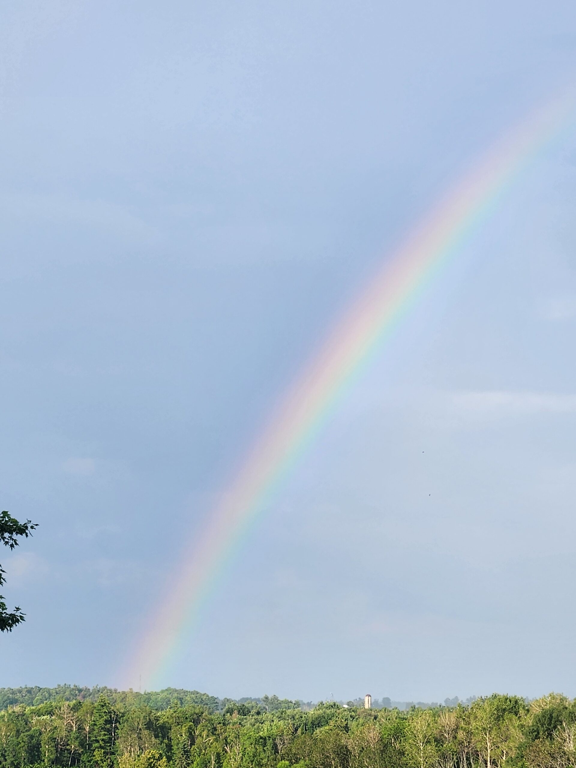 Rainbow Over the Workshop Property - Western Pride Woodworks Rainbow stretching across the sky above the Western Pride Woodworks property in rural Ontario.